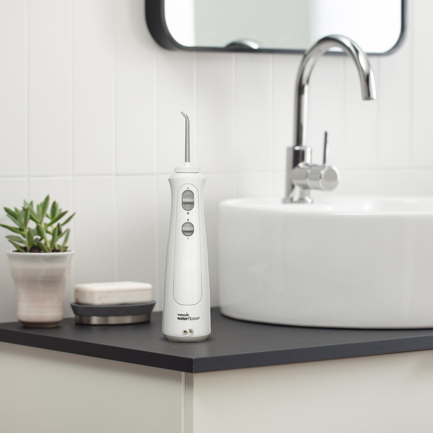 White Cordless Pearl Water Flosser WF-13CD010 in Bathroom