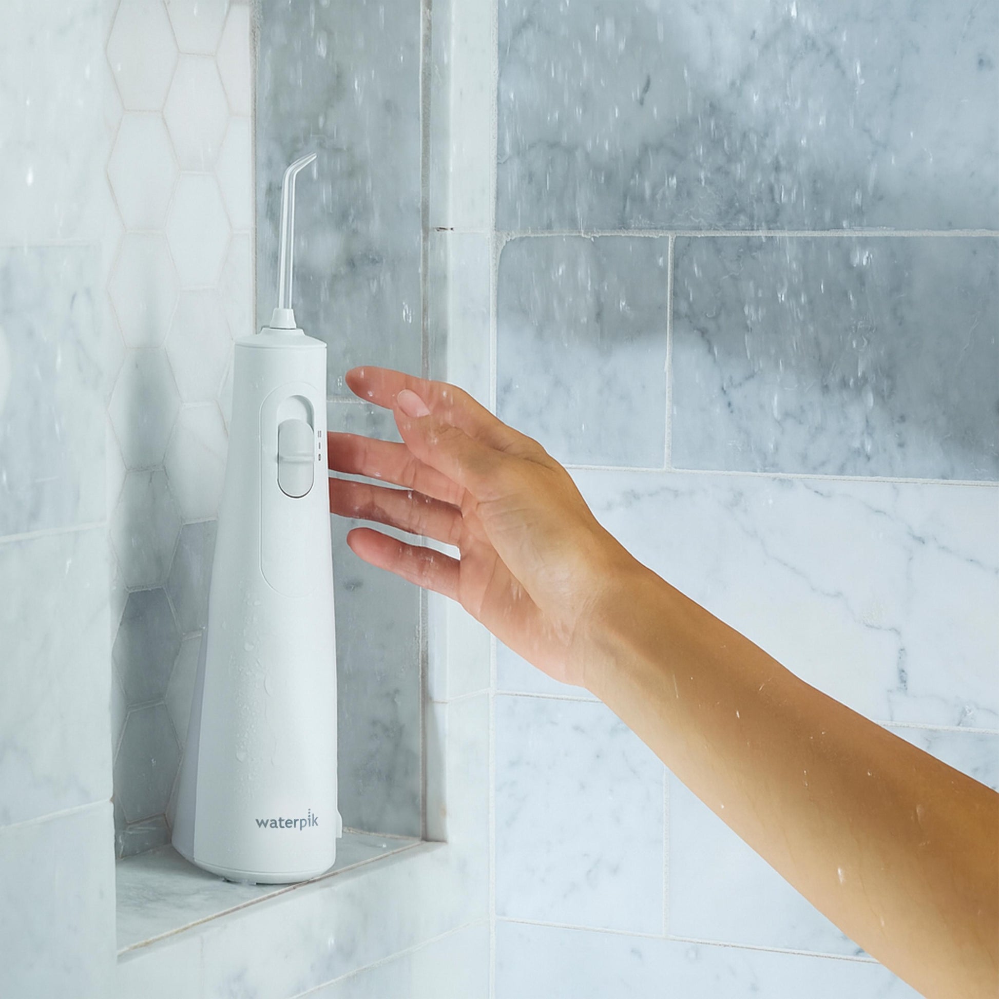 White Cordless 1100 Water Flosser WF-30CD010 in Shower