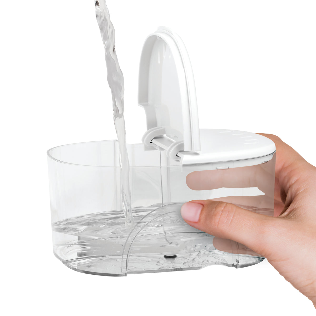 Filling the water reservoir of the white ION countertop water flosser.