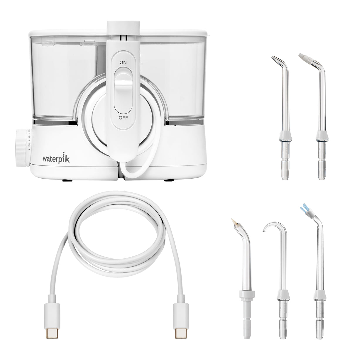 White ION countertop water flosser with 1 Precision tip, 1 Orthodontic tip, 1 Pik Pocket tip, 1 Implant Denture tip, 1 Plaque Seeker tip, and charging cable.